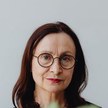 Portrait of a smiling woman with glasses